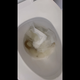 A woman in a black top sits on a toilet, viewed from beside the bowl. She lifts up and leans forward, holding her cheek as a turd slides out into the water, then wipes. The bowl is shown at the end. Presented in 720P vertical HD format. About 3 minutes.